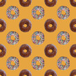 Seamless Pattern of Two Types of Delectable Chocolate Glazed Donuts on Caramel Backdrop