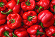 Pile of red bell peppers close-up