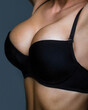 © Yevhen - Sexy female boob in black bra. Close up of breast of girl presenting her bra. Woman with big natural sexy boobs in lingerie. Plastic surger
