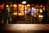 Fototapeta Łazienka - image of wooden table in front of abstract blurred background of restaurant lights