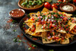 Mexican food - nachos with ground beer, tomatoes, cilantro and cheese