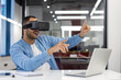 © Tetiana - Indian businessman experiencing virtual reality in office