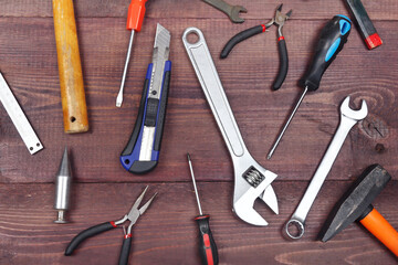 Wall Mural - Diverse of bench tools for repair work on wooden workshop. View from above.