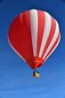 Red Hot air balloon on the slopes of Courchevel ski resort by winter