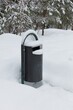 View of waste basket at Sorsakorpi recreational area in cloudy winter weather, Kerava, Finland.