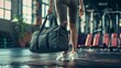 fit sporty woman in sportswear with gym bag wearing toned yoga pants and sneakers getting ready for exercise session at gym, lifestyle, fitness, healthy, fit, workout, jogger