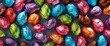A background of colorful foilwrapped chocolate eggs