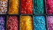 Detailed photograph of vibrant pelletized basic plastic resins in large industrial containers