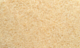 Fototapeta  - Basmati rice steamed close-up texture, brown rice background top view