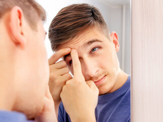 Canvas Print - Young Man with a Pimple