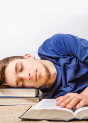 Poster - Young Man sleeping with a books