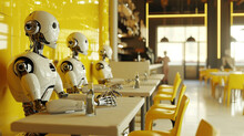 Group Of Robots Having A Meal At A Table In Front Of Yellow Wall In A Restaurant