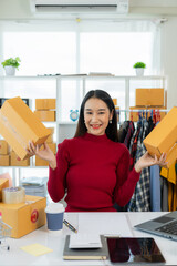 Wall Mural - Eco-friendly packaging boxes in Asian stores, home retail, small SME owners, working people, Asian women, Gen Z, happy people, smiling proudly. Vertical image.