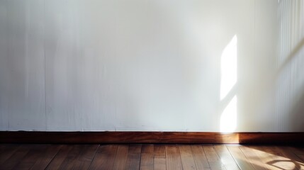 Aufkleber - A room with a white wall and wooden floor. The room is empty and has a very simple design