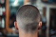 Detailed close-up photo of a man's freshly buzzed haircut from the back