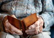 Elderly Man Holding an Empty Leather Wallet Close-up
