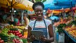 an african american woman in farmers market holding a tablet