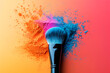 A makeup brush is surrounded by colorful powder. The brush is black and the powder is orange, blue, and pink. A makeup brush coated with vibrant colored powder, creating a striking visual effect