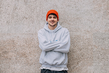 Poster - young man with hat on the street wall