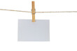 Empty white paper hanging on clothesline with clothespin on transparent background.