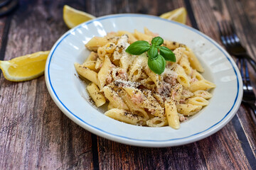 Wall Mural -  Italian home made  penne  pasta  with  tuna  fish, parmesan cheese and black pepper .