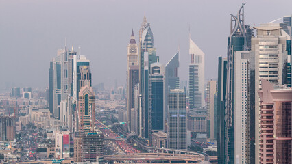 Poster - Aerial view to skyscrapers on Dubai downtown and Sheikh Zayed road day to night timelapse, Dubai, United Arab Emirates