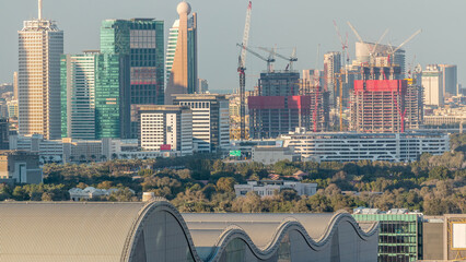 Wall Mural - Aerial sunset cityscape with architecture of Dubai downtown timelapse, United Arab Emirates.