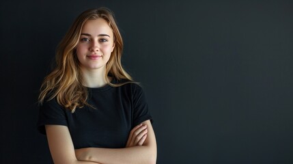 Wall Mural - a young russian woman with folded hands on dark background