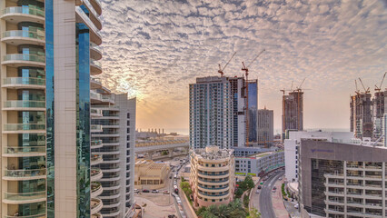 Wall Mural - Dubai Marina skyscrapers, port with luxury yachts and Marina promenade aerial sunset timelapse
