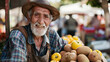 an elderly man sells fruit in the bazaar