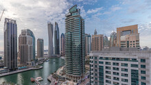 Aerial View Of Dubai Marina Residential And Office Skyscrapers With Waterfront Day To Night Timelapse