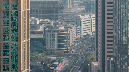 Wall Mural - Aerial view of a road intersection in a big city timelapse.