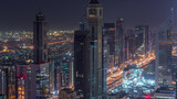 Fototapeta Miasto - Skyline of the buildings of Sheikh Zayed Road and DIFC aerial night to day timelapse in Dubai, UAE.