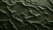 a dark military green textured background with a minimal shadow throught it like sand dunes