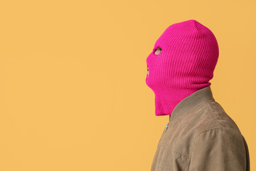 Poster - Handsome young man in balaclava on yellow background