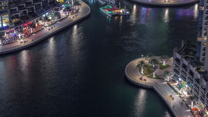 Wall Mural - Waterfront promenade in Dubai Marina aerial night timelapse. Dubai, United Arab Emirates