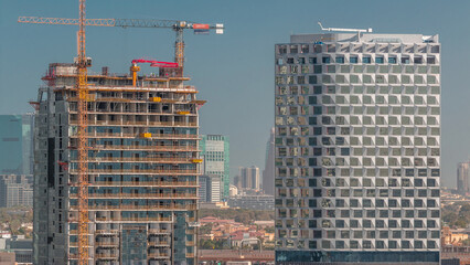 Wall Mural - Construction of new modern skyscrapers in luxury Dubai city,United Arab Emirates