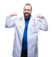 Sticker - Young caucasian doctor man wearing medical white coat over isolated background showing arms muscles smiling proud. Fitness concept.