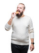 © Krakenimages.com - Young caucasian hipster man eating sweet waffle over isolated background with a confident expression on smart face thinking serious