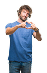 Sticker - Handsome hispanic model man over isolated background smiling in love showing heart symbol and shape with hands. Romantic concept.