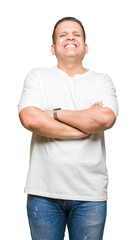 Wall Mural - Middle age arab man wearig white t-shirt over isolated background happy face smiling with crossed arms looking at the camera. Positive person.