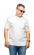 © Krakenimages.com - Middle age arab man wearig white t-shirt and sunglasses over isolated background looking away to side with smile on face, natural expression. Laughing confident.