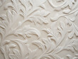 Closeup shot captures fresh ecru plaster decoration on wall