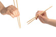 © Nikolay - Female hand holding wooden sushi chopsticks isolated on white background.