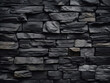 Stone blocks compose the textured background of the black wall