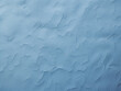 Close-up view reveals intricate details of a blue pastel wall texture