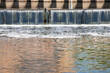 Small waterfall on the canal in the Leeds City Centre showing water falling down from the top rive to the bottom