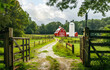 Red barn and silo sit on farm in the rural countryside
