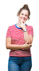 Poster - Beautiful brunette curly hair young girl wearing casual look over isolated background looking confident at the camera with smile with crossed arms and hand raised on chin. Thinking positive.