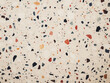 Background showcases a patterned washed terrazzo surface